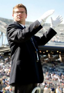 Caleb conducting at a football game as a Grad Assistant in 2010.
